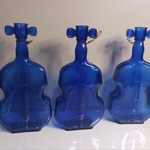 Vintage blue violin Cobalt bottles, with wire hangers, 8 in tall